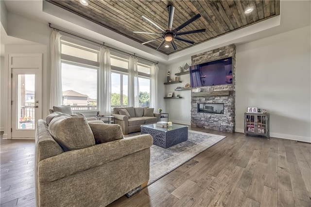 24976 W 87th St, Lenexa, KS 66227 - living area with a raised ceiling, wooden ceiling, hardwood / wood-style floors, ceiling fan, and recessed lighting