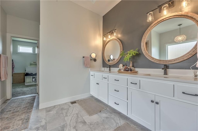 24976 W 87th St, Lenexa, KS 66227 - full bathroom featuring double vanity and marble look tiles