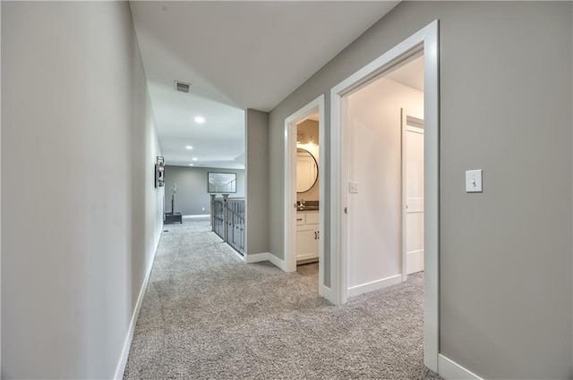 24976 W 87th St, Lenexa, KS 66227 - hall with light colored carpet, recessed lighting, and an upstairs landing