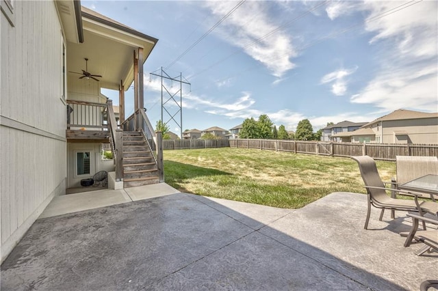 24976 W 87th St, Lenexa, KS 66227 - fenced backyard with a patio, ceiling fan, stairs, and a residential view