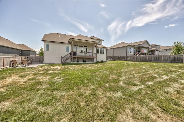 24976 W 87th St, Lenexa, KS 66227 - back of property with a ceiling fan, stairway, a fenced backyard, and a patio