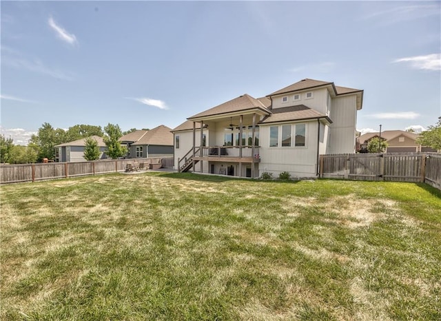 24976 W 87th St, Lenexa, KS 66227 - back of property with a fenced backyard, stairway, ceiling fan, and a shingled roof