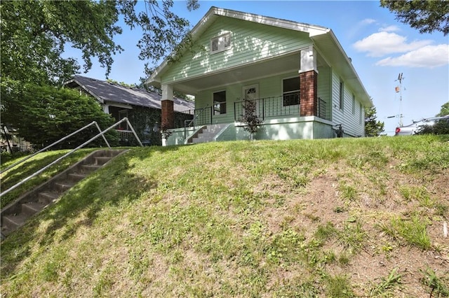 1962 N 28th St, Kansas City, KS 66104 - view of front of house with stairway and covered porch