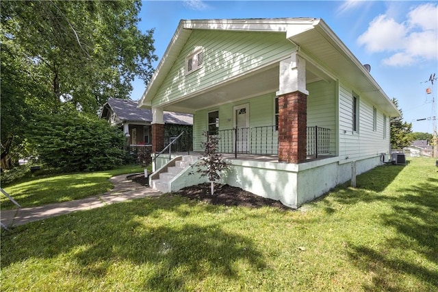 1962 N 28th St, Kansas City, KS 66104 - view of front facade featuring a porch and a front lawn