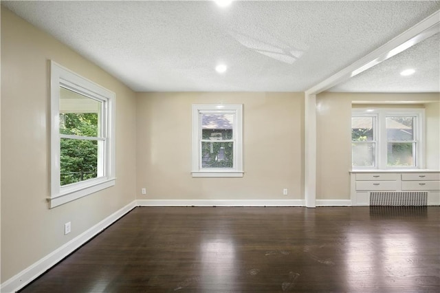 1962 N 28th St, Kansas City, KS 66104 - unfurnished room featuring a textured ceiling and wood finished floors