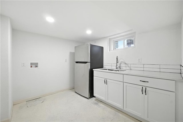 1962 N 28th St, Kansas City, KS 66104 - kitchen with freestanding refrigerator, recessed lighting, light countertops, and white cabinets
