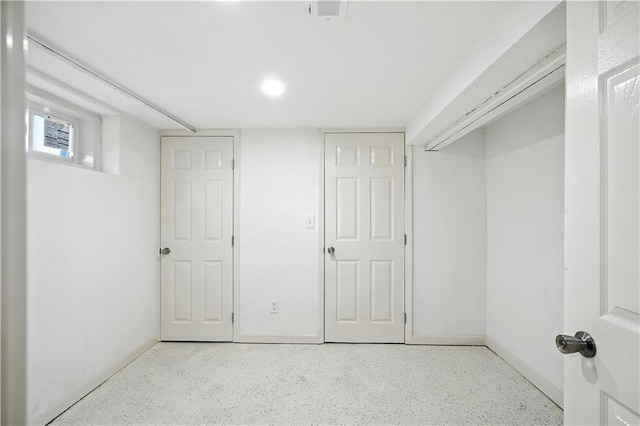 1962 N 28th St, Kansas City, KS 66104 - unfurnished bedroom with speckled floor and recessed lighting