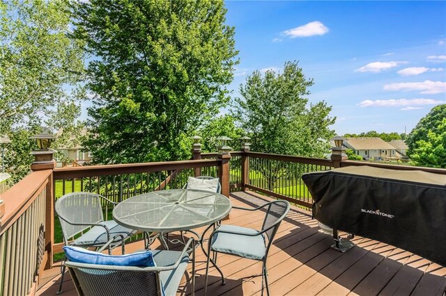 8103 NE 111th Ter, Kansas City, MO 64157 - wooden deck with outdoor dining space