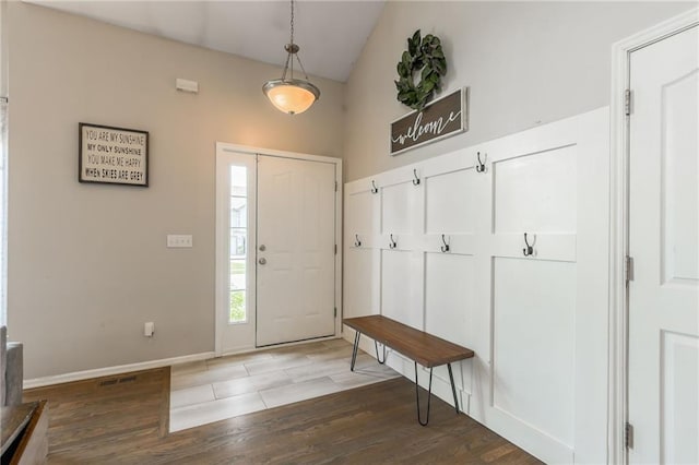 8103 NE 111th Ter, Kansas City, MO 64157 - foyer entrance featuring wood finished floors and vaulted ceiling
