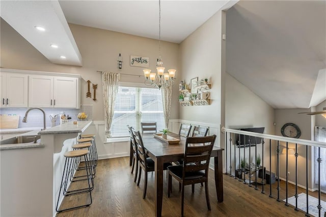 8103 NE 111th Ter, Kansas City, MO 64157 - dining space with dark wood-style flooring, a chandelier, recessed lighting, and lofted ceiling