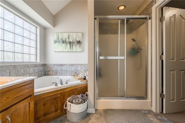 8103 NE 111th Ter, Kansas City, MO 64157 - full bath featuring a shower stall, a garden tub, lofted ceiling, and vanity