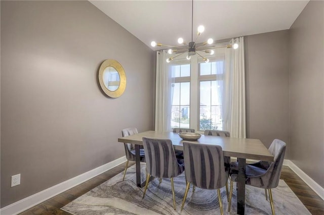 15716 Canterbury St, Overland Park, KS 66085 - dining room featuring a chandelier, dark wood-type flooring, and lofted ceiling
