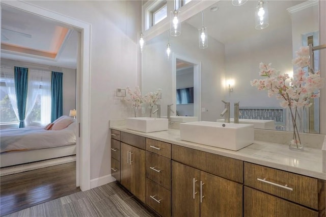 15716 Canterbury St, Overland Park, KS 66085 - ensuite bathroom featuring double vanity and baseboards