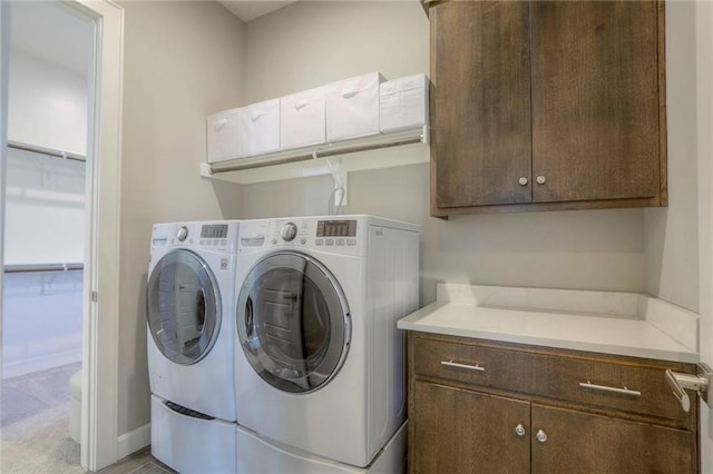 15716 Canterbury St, Overland Park, KS 66085 - washroom with washing machine and clothes dryer and cabinet space