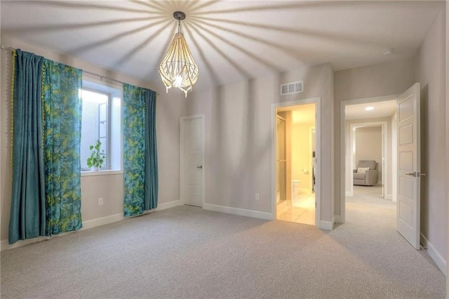 15716 Canterbury St, Overland Park, KS 66085 - spare room with carpet flooring, a chandelier, and a smoke detector