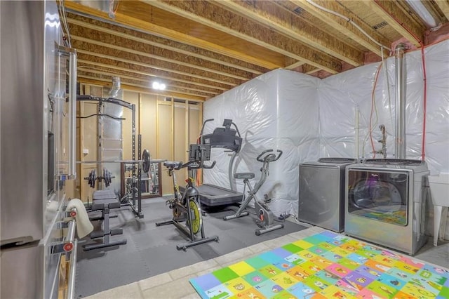 15716 Canterbury St, Overland Park, KS 66085 - workout room featuring washing machine and clothes dryer