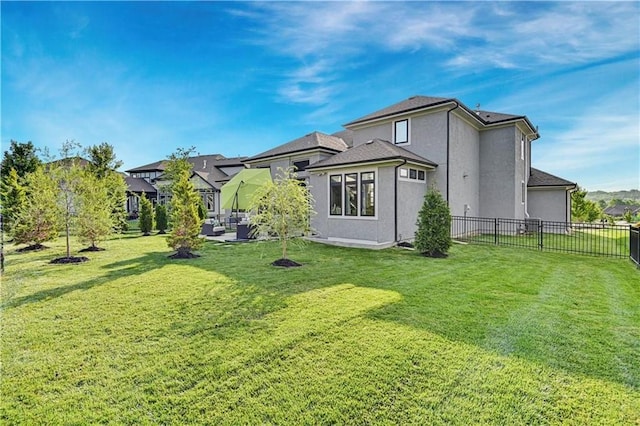 15716 Canterbury St, Overland Park, KS 66085 - rear view of house featuring stucco siding and a patio area