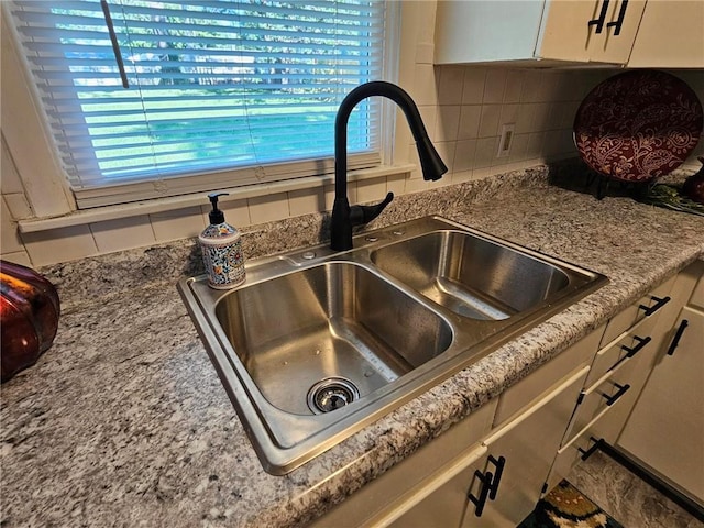 1615 N High St, Independence, MO 64050 - kitchen view of tasteful backsplash and white cabinetry