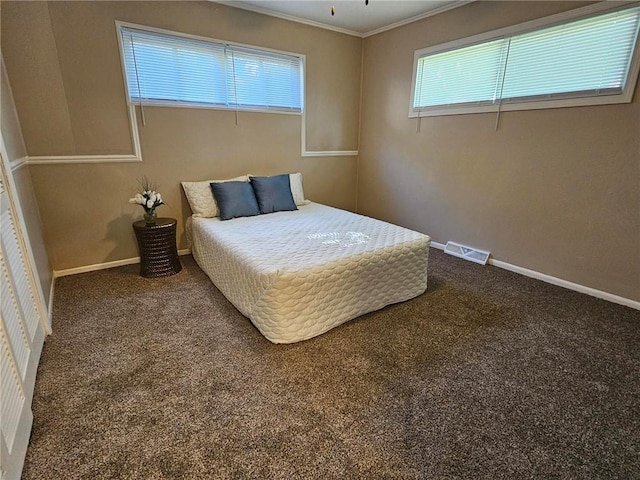 1615 N High St, Independence, MO 64050 - bedroom featuring multiple windows, ornamental molding, and carpet floors