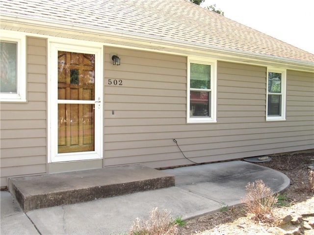 502 N Jefferson St, Spring Hill, KS 66083 - property entrance featuring a shingled roof