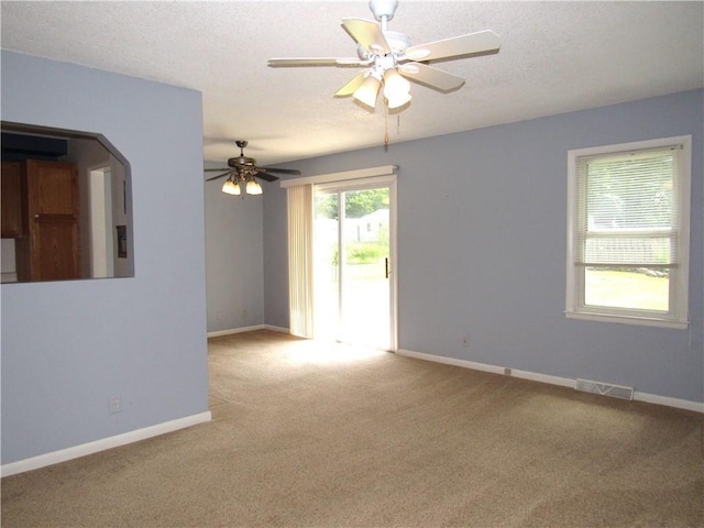 502 N Jefferson St, Spring Hill, KS 66083 - empty room with carpet floors, ceiling fan, and a textured ceiling