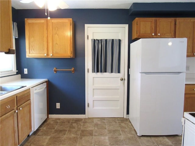 502 N Jefferson St, Spring Hill, KS 66083 - kitchen with white appliances, ceiling fan, light countertops, and brown cabinetry