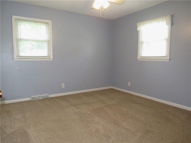 502 N Jefferson St, Spring Hill, KS 66083 - carpeted spare room with ceiling fan and baseboards