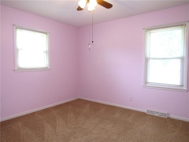 502 N Jefferson St, Spring Hill, KS 66083 - carpeted spare room with ceiling fan and plenty of natural light