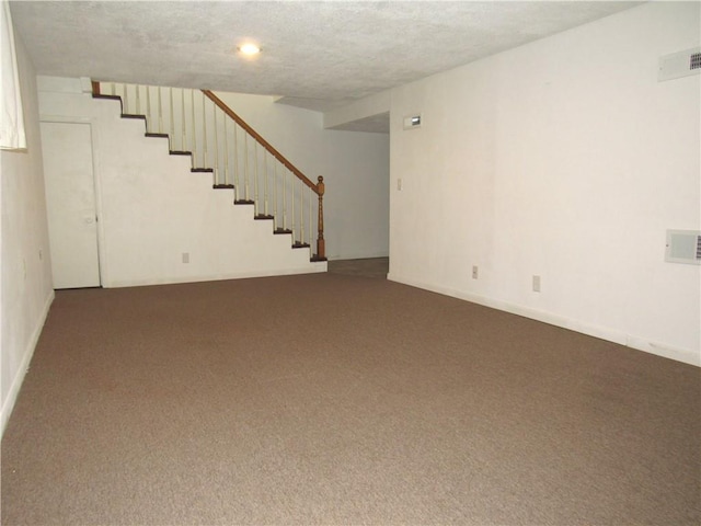 502 N Jefferson St, Spring Hill, KS 66083 - unfurnished living room featuring dark colored carpet and stairway