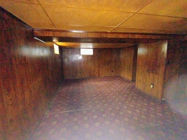 5001 E 41st St, Kansas City, MO 64130 - finished basement featuring wooden walls and a paneled ceiling