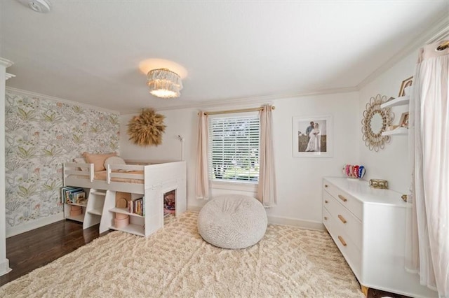 1295 W 71st Ter, Kansas City, MO 64114 - bedroom with crown molding, wallpapered walls, and wood finished floors