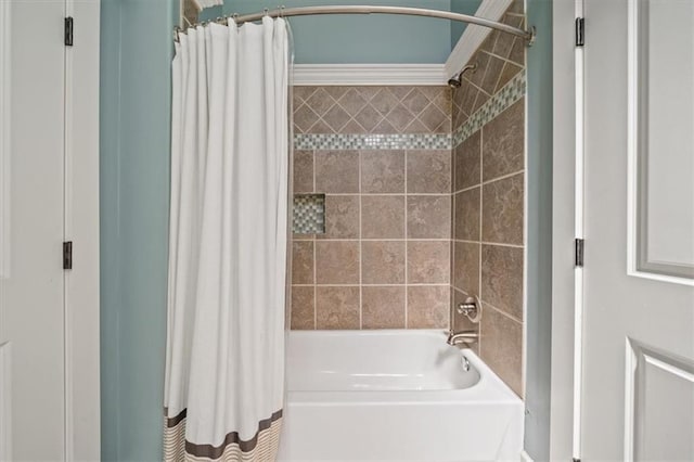 1295 W 71st Ter, Kansas City, MO 64114 - bathroom featuring shower / bathtub combination with curtain