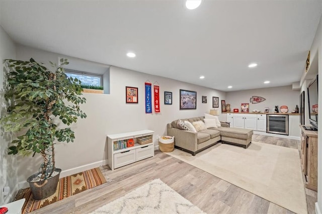 1295 W 71st Ter, Kansas City, MO 64114 - living room featuring wine cooler, light wood-style floors, and recessed lighting