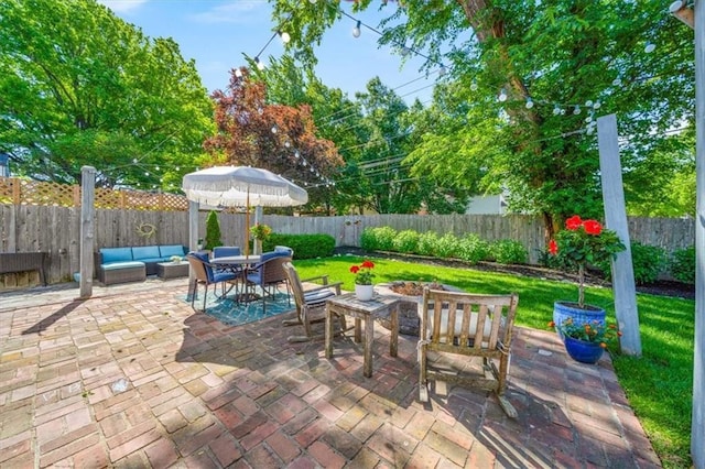 1295 W 71st Ter, Kansas City, MO 64114 - fenced backyard with an outdoor living space and a patio