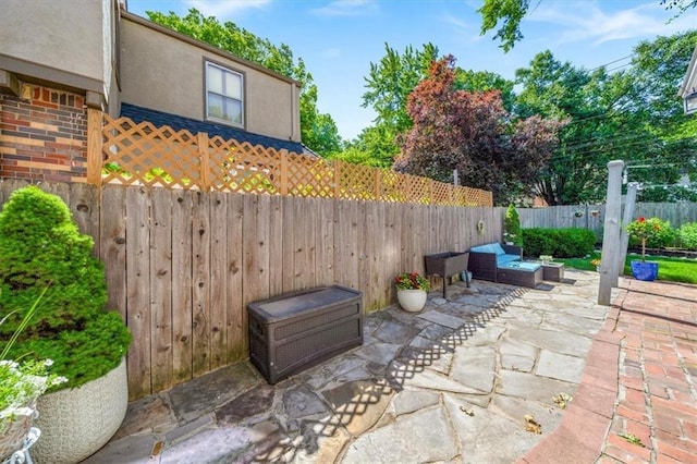 1295 W 71st Ter, Kansas City, MO 64114 - fenced backyard featuring a patio