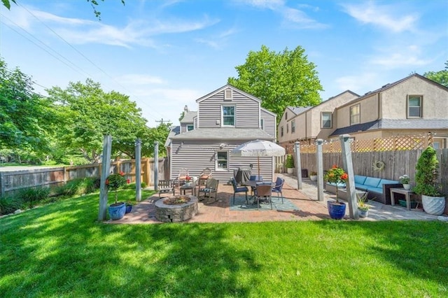 1295 W 71st Ter, Kansas City, MO 64114 - rear view of property featuring a patio, a fenced backyard, and outdoor lounge area