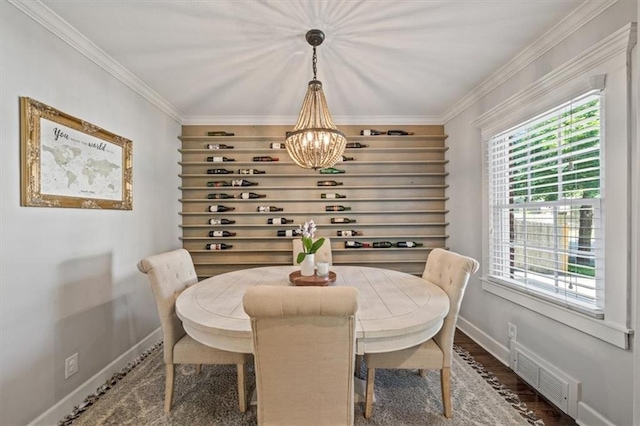 1295 W 71st Ter, Kansas City, MO 64114 - dining room with a chandelier and ornamental molding
