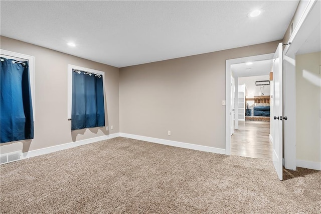 6727 Harvard Ave, Raytown, MO 64133 - unfurnished room featuring light colored carpet, recessed lighting, and a textured ceiling