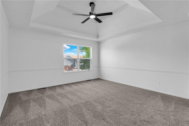 220 NE Dreamweaver Ave, Lees Summit, MO 64086 - carpeted empty room featuring a tray ceiling and a ceiling fan