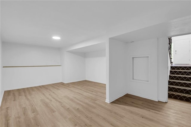 220 NE Dreamweaver Ave, Lees Summit, MO 64086 - finished basement featuring light wood-style flooring, stairway, and recessed lighting