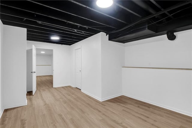 220 NE Dreamweaver Ave, Lees Summit, MO 64086 - finished below grade area with light wood finished floors and baseboards