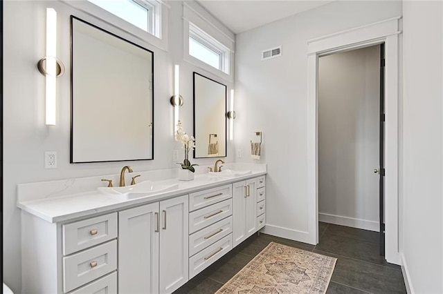 18501 Mohawk Ln, Overland Park, KS 66085 - bathroom featuring double vanity and baseboards