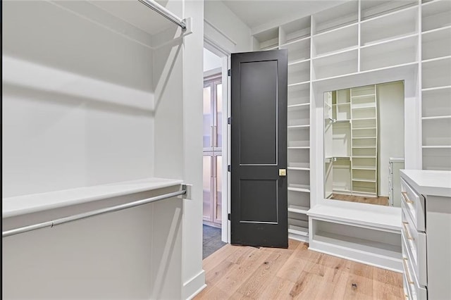 18501 Mohawk Ln, Overland Park, KS 66085 - spacious closet featuring light wood-type flooring