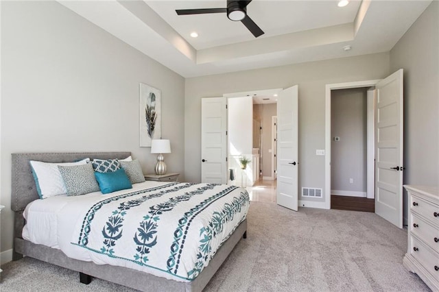 17162 S Heatherwood St, Olathe, KS 66062 - bedroom with light colored carpet, a raised ceiling, recessed lighting, and ceiling fan
