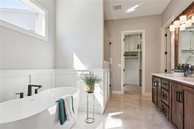 17162 S Heatherwood St, Olathe, KS 66062 - full bath with vanity, a freestanding bath, and marble finish flooring