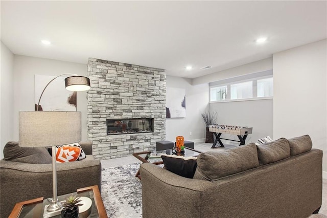 17162 S Heatherwood St, Olathe, KS 66062 - carpeted living area with a stone fireplace and recessed lighting