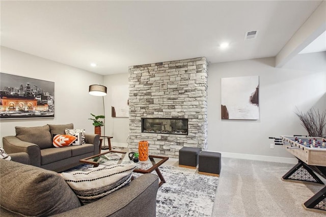17162 S Heatherwood St, Olathe, KS 66062 - living room with carpet, a stone fireplace, and recessed lighting