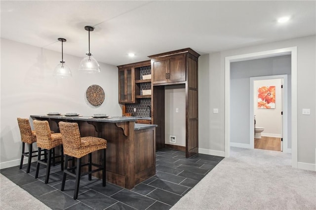 17162 S Heatherwood St, Olathe, KS 66062 - indoor wet bar with recessed lighting, tasteful backsplash, and decorative light fixtures