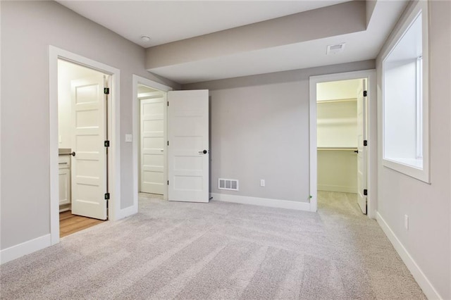 17162 S Heatherwood St, Olathe, KS 66062 - unfurnished bedroom with carpet flooring, a spacious closet, ensuite bath, and a closet
