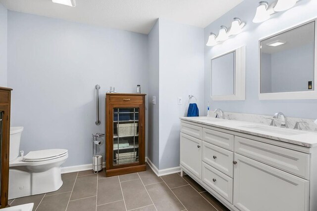 1100 Sycamore Ridge Dr, Lansing, KS 66043 - bathroom featuring double vanity and tile patterned floors